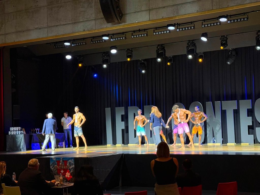 Athletes on stage during judging at Mr. Universe Switzerland 2026.