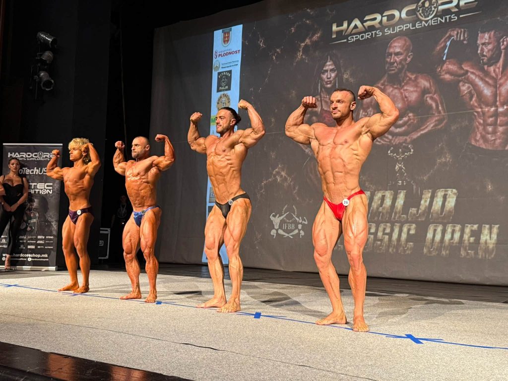 Competitors in the front double-biceps pose.